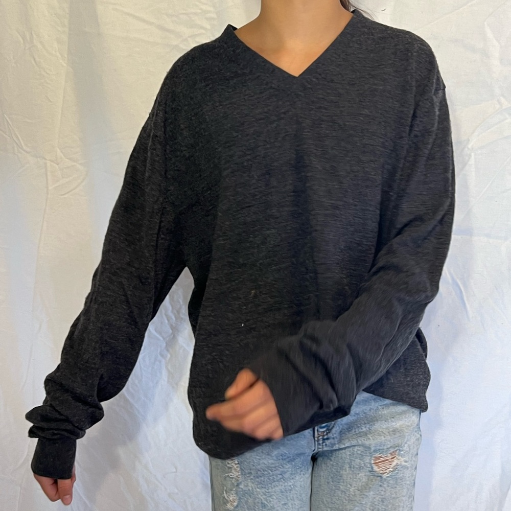 Grey v neck sweater.